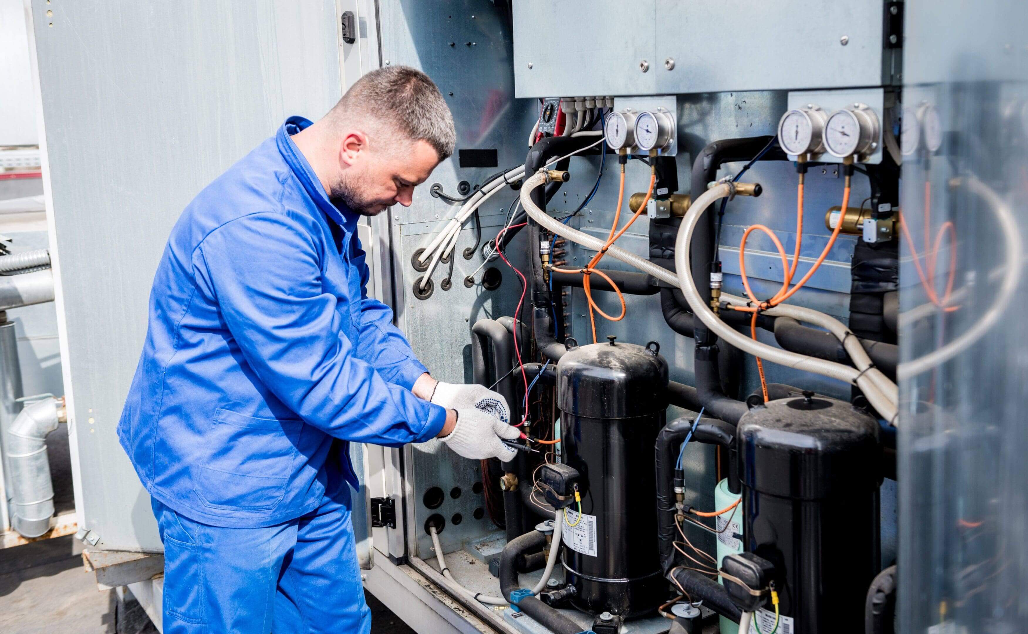 Professional technicians performing expert commercial air conditioner repair for offices